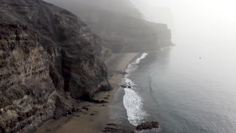 aerial view of gui gui beach, las palmas de gran canaria during calima , 4k drone footage-6