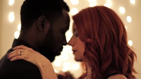 interracial couple dancing closely