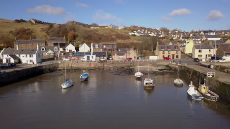 aerial footage of gourdon village and fishing harbour on a sunny day, aberdeenshire, scotland