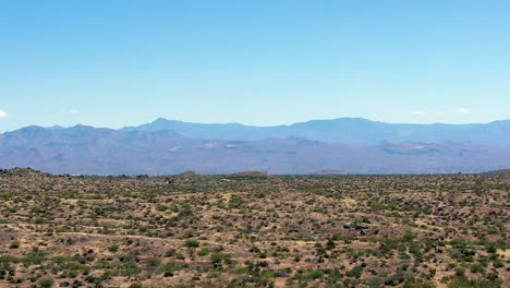 aerial long flight over the beautiful open sonoran desert toward the four peaks in the matazel mountains, scottsdale, arizona concept: travel, tourism