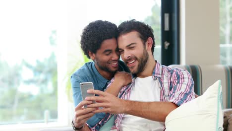 Gay-couple-on-smartphone-together