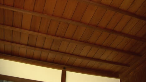 pan across ceiling of japanese house with hinoki wood beams and koshi latticework