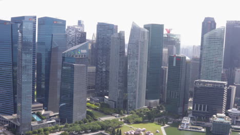 modern skyscrapers in singapore city skyline on a sunny day, aerial view