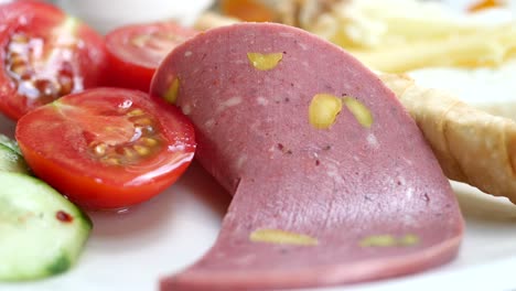 turkish breakfast with sausage and vegetables