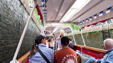 people enjoying a scenic canal boat tour