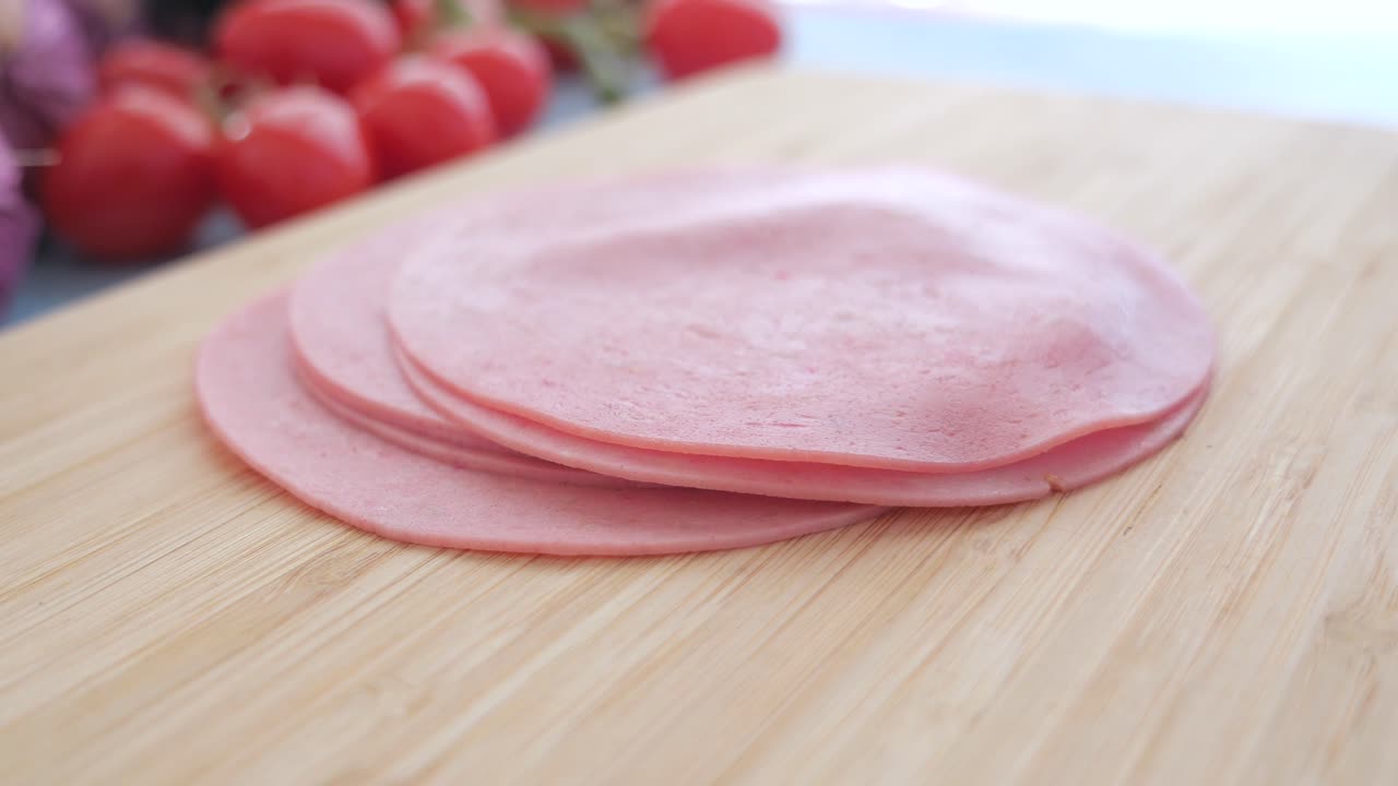 Sliced Ham on a Wooden Cutting Board