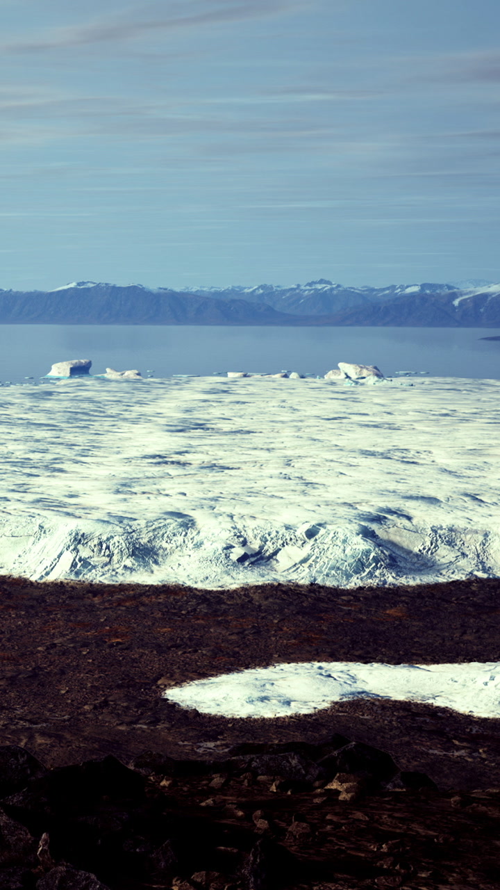 Breathtaking view of vast ice fields under clear skies in greenland