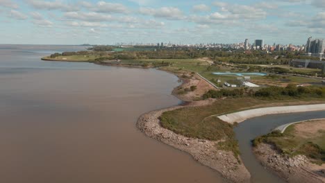 aerial backward movement of vicente lopez costal walk, revealing the city in background