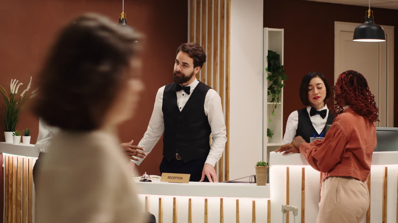 Receptionists answering guests inquiries
