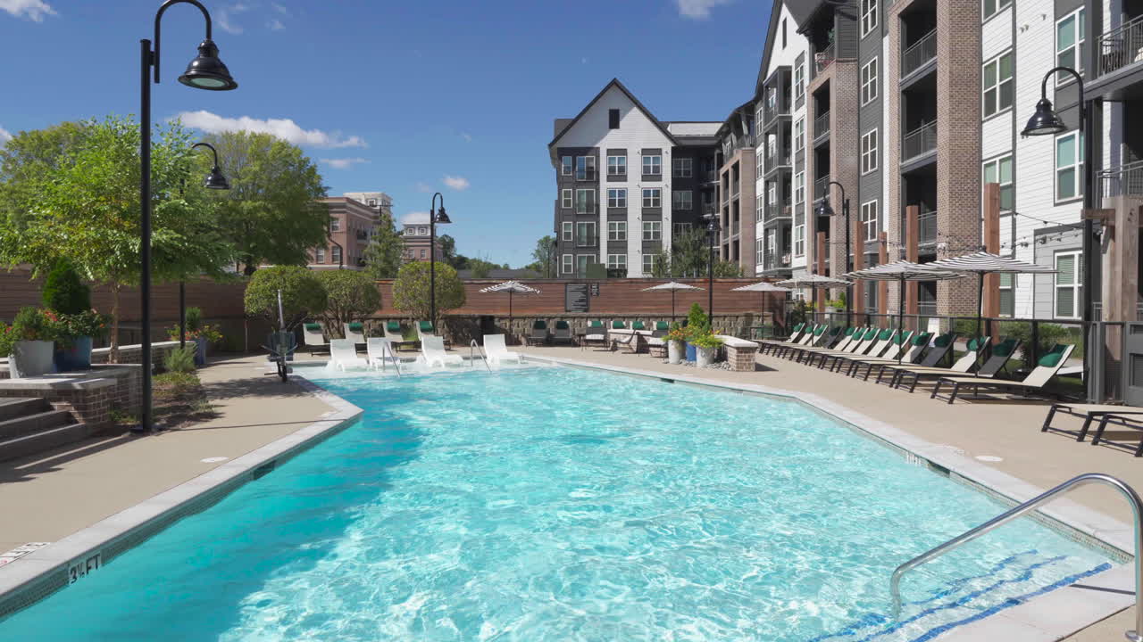 Luxury apartment complex swimming pool on a bright sunny day