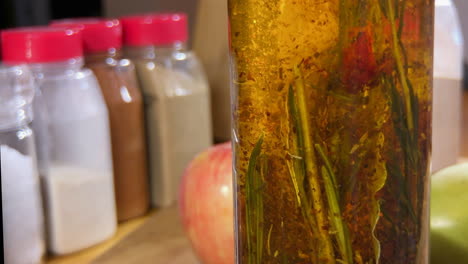 close up of herb infused olive oil