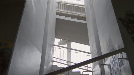 two sportsmen running on urban stairs