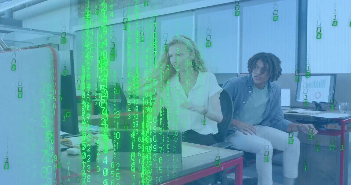 Woman typing tech space causing code flooding tablet while male coworker leaning in explaining code