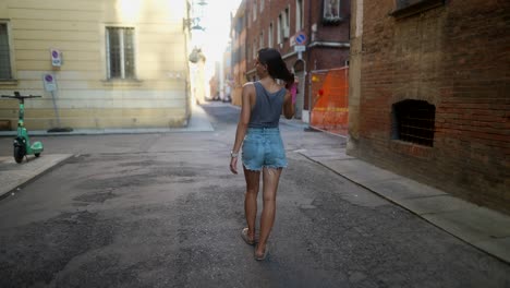 woman walking down a city street