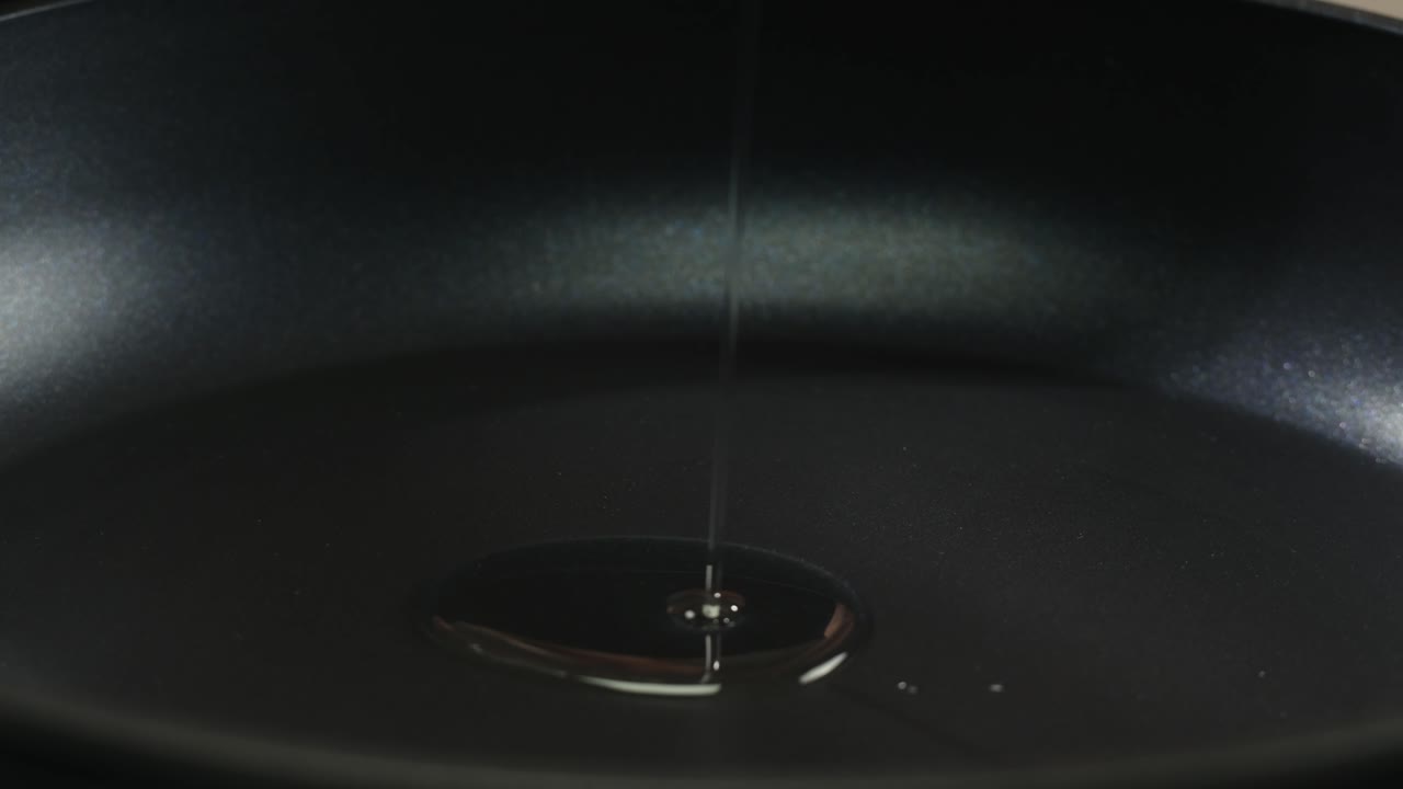 Pouring olive oil in different dishes close-up. Using in cooking for frying foods or as a salad dressing omega 3. Olive oil is popular supplement for meals and salads. . High quality 4k footage