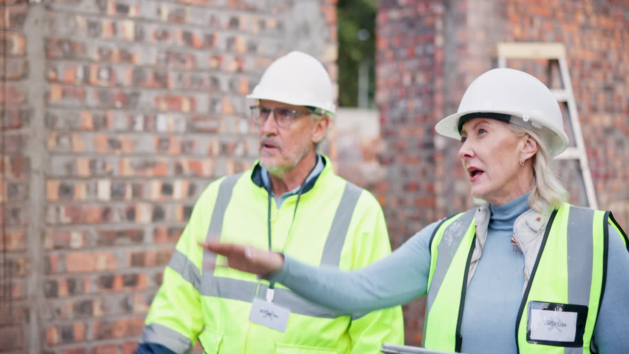 Construction workers inspecting a building