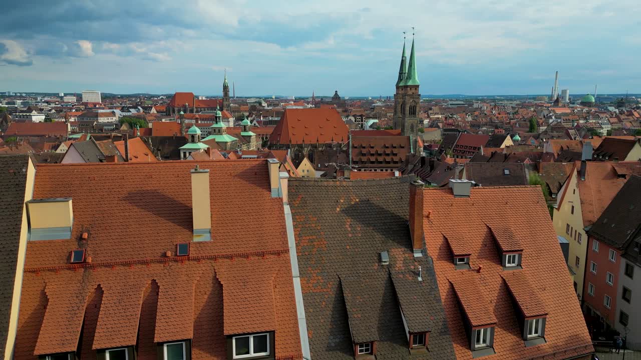 4K Aerial Drone Video of Copper-clad Cupolas, Church Spiers, and Tiled Rooftops of the Skyline of Downtown Nurnberg, Germany