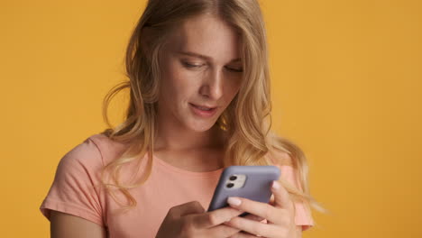 caucasian woman texting on smartphone.