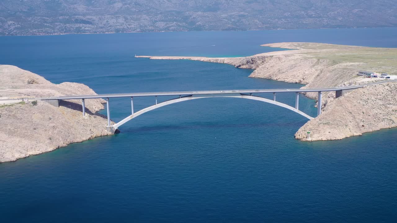 Aerial rising over Pag Bridge communicating the island with the Croatian mainland