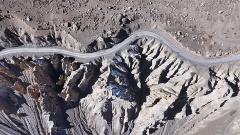 aerial view of a mountain road through a canyon