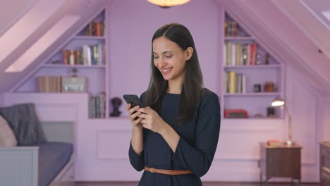 Happy-Indian-girl-chatting-with-someone