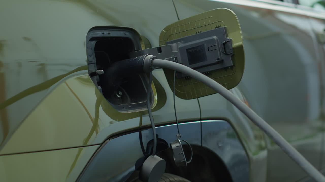 Close Up Shot Of Ev Plug Connected To Electric Car, Concept Of Zero Emissions