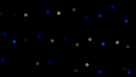 christmas lights glowing on a black background,bokeh flickering, christmas lights.
