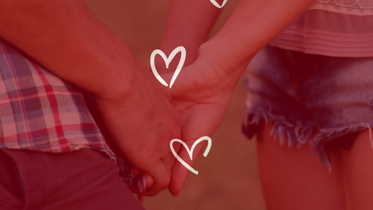 animación de corazones blancos sobre una pareja caucásica cogida de la mano