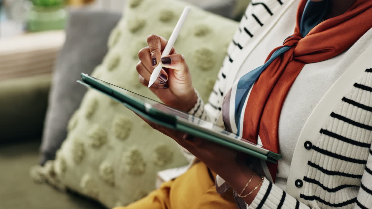 Woman using a tablet with a stylus