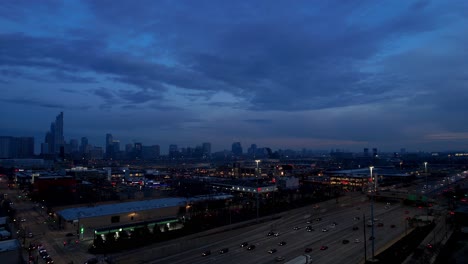 Evening-Dramatic-Sky-With-City-Skyline-And-Road-And-Highway-Traffic