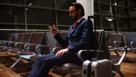 commuters using mobile phone in waiting area 4k