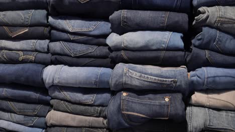 stacks of different types of jeans