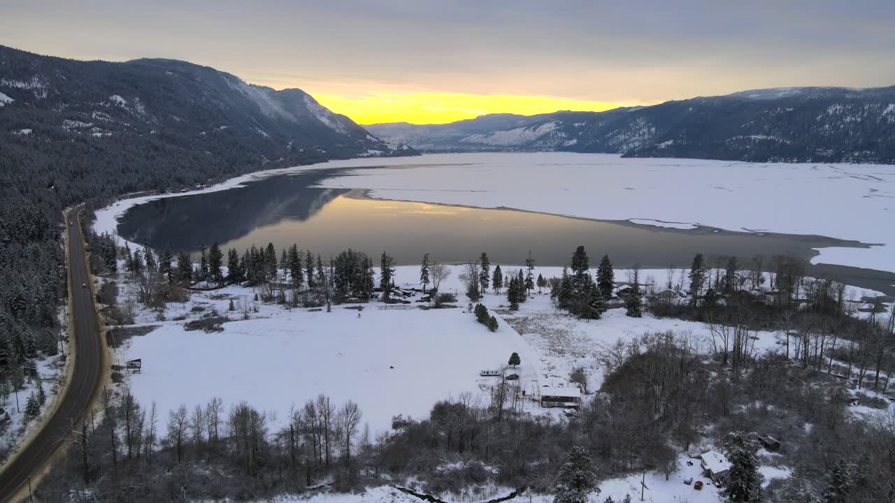 Premium stock video - Sunset over little shuswap lake in british columbia: winter's blissful scenery