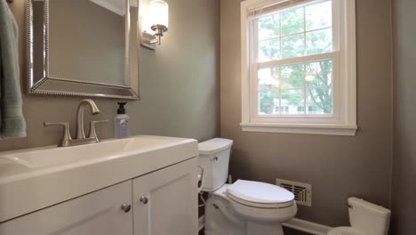 gimbal footage pushing into a small luxury bathroom and water closet