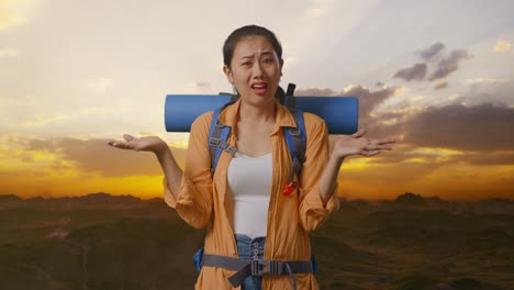 confused traveler in mountains at sunset