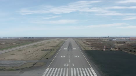 aerial of reykjavik runway on clear day with no air traffic and distant horizon