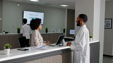 doctor and patient interaction at reception