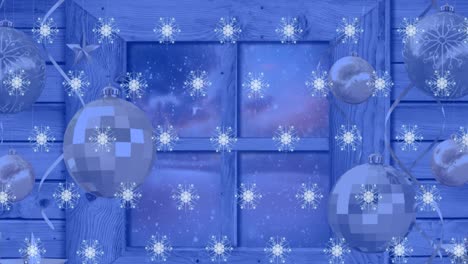 Animation-of-snowflakes-over-window-with-baubles-and-winter-landscape