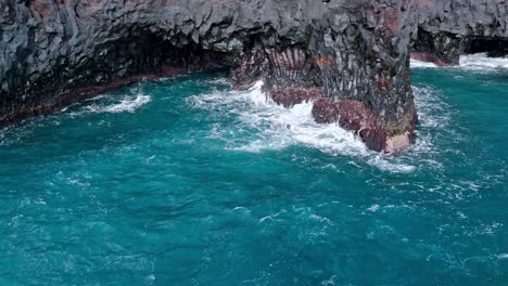 volcanic cliffs in atlantic ocean in los hervideros in lanzarote, canary islands, spain.