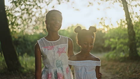 Two young sisters in nature