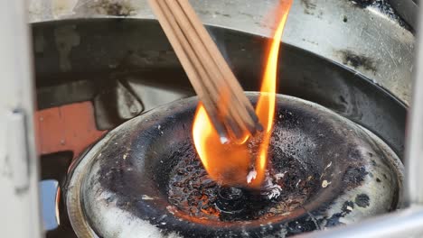 burning incense in a temple