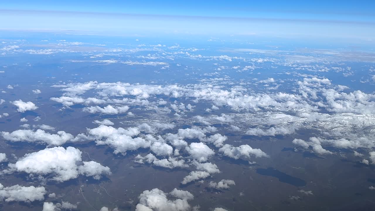 an aerial crossing through the pilot eyes of two jet airplanes flying opposite direction under a blue sky.