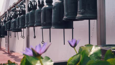 Medium-Shot-Of-Bells-in-a-Row-Outside