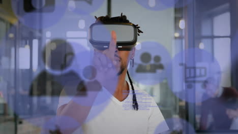 Animation of data processing and social media icons over biracial man wearing vr headset