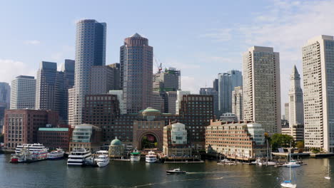 drone moving through boston harbor towards the boston skyline