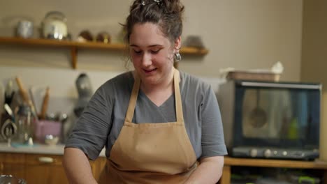 a woman bakes in her kitchen.
