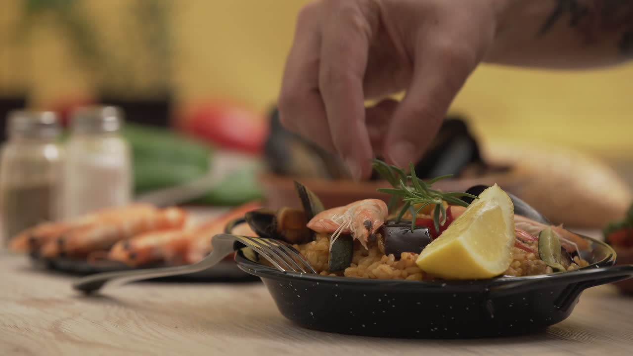 Paella traditional Spanish food, served on tapa plate