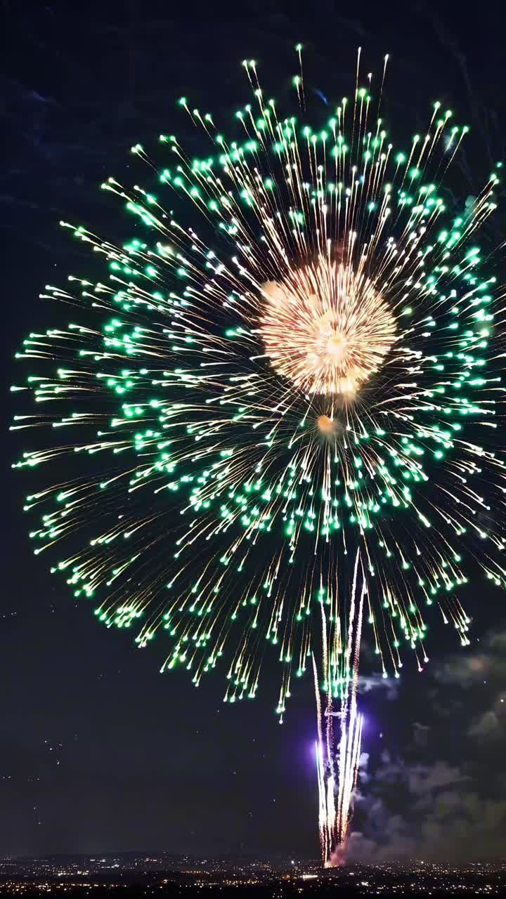 Aerial view of a vibrant fireworks display against a night sky, captured in a video