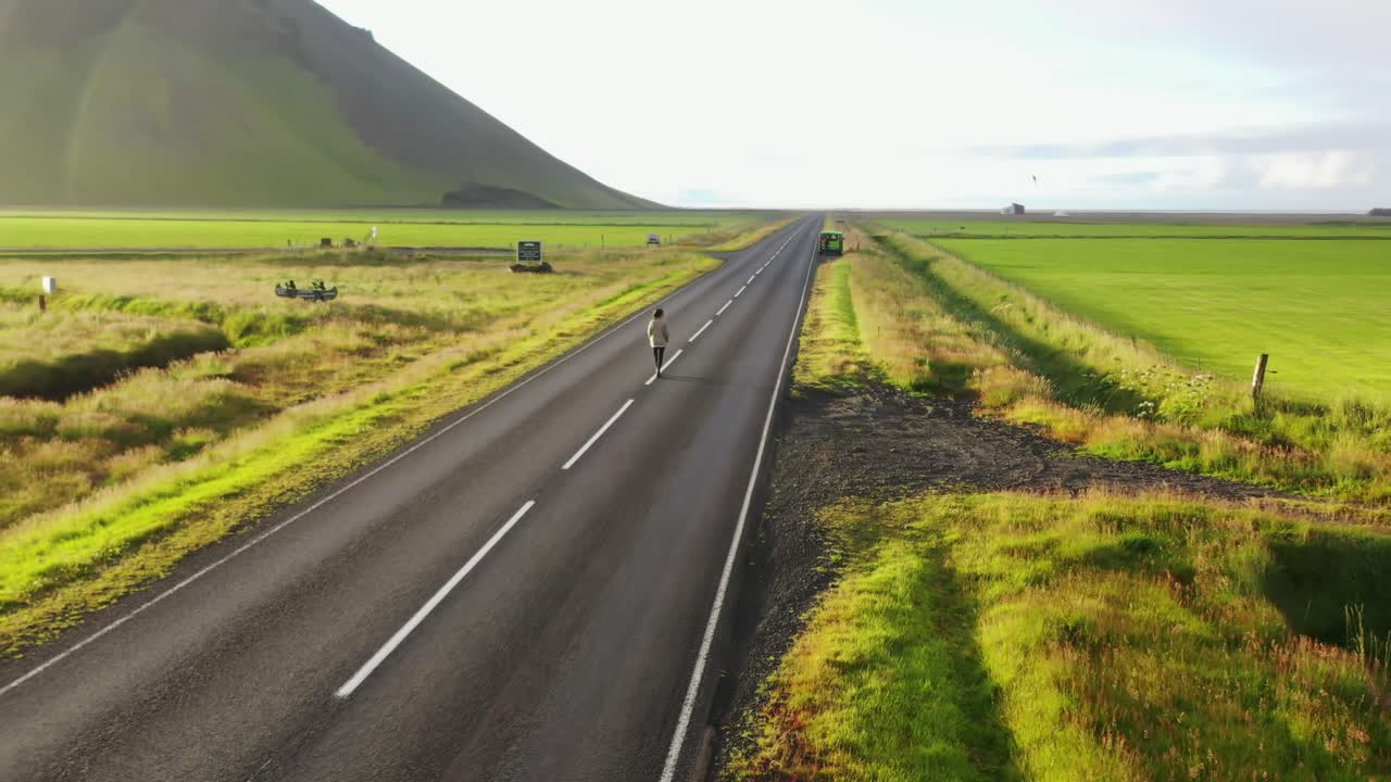 Free stock video - Girl walking on a street in iceland during