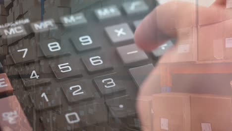 Animation-of-person-using-calculator-with-stacks-of-boxes-in-warehouse